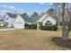 Attractive single-story home with a well-kept lawn, neat shrubbery, and attached garage at 8153 Governors Walk, North Charleston, SC 29418