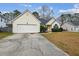 Beautiful single-Gathering home with manicured lawn, mature shrubs, and two-car garage at 8153 Governors Walk, North Charleston, SC 29418