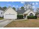 Charming single-story home features a well-maintained yard, attached garage, and welcoming entrance at 8153 Governors Walk, North Charleston, SC 29418