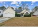 Inviting single Gathering home with blue shutters, mature landscaping, and a two car garage at 8153 Governors Walk, North Charleston, SC 29418