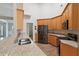 Modern kitchen features stainless steel appliances, granite countertops and wooden cabinets at 8153 Governors Walk, North Charleston, SC 29418