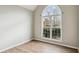 Living room with wood floors and lots of natural light from the large bright window at 8153 Governors Walk, North Charleston, SC 29418