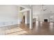 Spacious open-concept living area featuring wood floors and a neutral color palette at 8153 Governors Walk, North Charleston, SC 29418