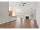 Living room with hardwood floors, fireplace, and view of kitchen at 8153 Governors Walk, North Charleston, SC 29418