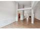 Open-concept living room featuring wood floors, with direct view to the kitchen at 8153 Governors Walk, North Charleston, SC 29418