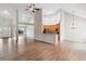 Open-concept living room with hardwood floors and access to kitchen at 8153 Governors Walk, North Charleston, SC 29418