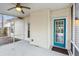 View of the screened in porch with ceiling fan and view of the backyard at 8153 Governors Walk, North Charleston, SC 29418