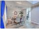 Elegant dining room featuring a modern chandelier, round table with chairs, and blue curtains at 100 Hunters Wood Dr, Summerville, SC 29485