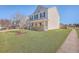 Beautiful two-story home featuring a manicured lawn, welcoming front porch, and classic architectural design at 100 Hunters Wood Dr, Summerville, SC 29485