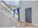 Entryway with staircase, wood floors, and a contemporary black front door, creating a modern and inviting space at 100 Hunters Wood Dr, Summerville, SC 29485