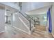 Spacious foyer with high ceilings, a staircase, wood-look flooring, and an open view into other living areas at 100 Hunters Wood Dr, Summerville, SC 29485