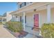 Attractive front porch with a red door, manicured shrubs, and views of the residential neighborhood at 100 Hunters Wood Dr, Summerville, SC 29485