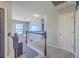 Upstairs hallway with neutral walls and carpet, as well as black and white stairway railing at 100 Hunters Wood Dr, Summerville, SC 29485