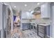 Modern kitchen featuring stainless steel appliances, marble counters, and view to dining area at 100 Hunters Wood Dr, Summerville, SC 29485
