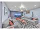 Spacious living room with comfortable couches, modern decor, and a large entertainment center at 100 Hunters Wood Dr, Summerville, SC 29485