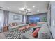 Comfortable living room with gray sofas, a ceiling fan, a large screen television, and stylish decor at 100 Hunters Wood Dr, Summerville, SC 29485