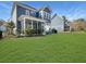 Spacious backyard featuring well-maintained lawn and patio area at 1020 Lyle Way, Mount Pleasant, SC 29466