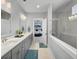 Bright, spacious bathroom featuring double sinks and tiled shower with a glass partition at 1020 Lyle Way, Mount Pleasant, SC 29466