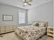 Inviting bedroom with neutral walls, ceiling fan and an ornate floral comforter at 1020 Lyle Way, Mount Pleasant, SC 29466