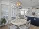 Charming dining area is adjacent to the kitchen, and features a stylish light fixture at 1020 Lyle Way, Mount Pleasant, SC 29466