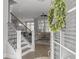 Inviting entryway with a staircase, light wood floors, and views of the living room through glass doors at 1020 Lyle Way, Mount Pleasant, SC 29466