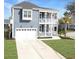 Charming two-story home featuring a double porch, white trim, and a well-manicured front yard at 1020 Lyle Way, Mount Pleasant, SC 29466