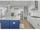Modern kitchen boasts stainless steel appliances, white cabinets, and a large island at 1020 Lyle Way, Mount Pleasant, SC 29466