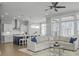 Open concept living room featuring hardwood floors and a view of the kitchen and dining area at 1020 Lyle Way, Mount Pleasant, SC 29466