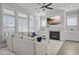 Bright living room features a fireplace, large windows, and comfortable seating at 1020 Lyle Way, Mount Pleasant, SC 29466