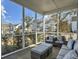 Relaxing screened porch with comfortable seating and neighborhood views at 1020 Lyle Way, Mount Pleasant, SC 29466