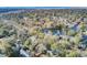 Aerial view of a lakeside neighborhood with mature trees and waterways at 1048 Wharf Indigo Pl, Mount Pleasant, SC 29464