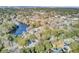 Aerial view of a property with a pool, nestled among mature trees and waterways at 1048 Wharf Indigo Pl, Mount Pleasant, SC 29464