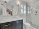 This bathroom features a glass shower, a white toilet, and a mirror at 1048 Wharf Indigo Pl, Mount Pleasant, SC 29464