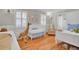 Bright Bedroom with white crib, giraffe, rocker, and wood floors at 1048 Wharf Indigo Pl, Mount Pleasant, SC 29464