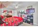 This spirited bedroom features a sports theme and fan ceiling light at 1048 Wharf Indigo Pl, Mount Pleasant, SC 29464