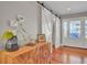 Beautiful foyer with hardwood floors, barn door, and natural light creating a welcoming atmosphere at 1048 Wharf Indigo Pl, Mount Pleasant, SC 29464