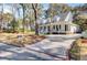 Inviting home with a brick-lined driveway and picturesque landscaping at 1048 Wharf Indigo Pl, Mount Pleasant, SC 29464