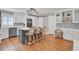 Modern kitchen with stainless steel appliances, a center island with seating, and custom cabinetry at 1048 Wharf Indigo Pl, Mount Pleasant, SC 29464