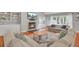 Bright and airy living room with a fireplace, built-in shelving, and comfortable seating area at 1048 Wharf Indigo Pl, Mount Pleasant, SC 29464