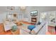 Inviting living room featuring a fireplace, TV, comfortable seating, and access to the outdoors at 1048 Wharf Indigo Pl, Mount Pleasant, SC 29464