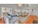 Spacious living room with hardwood floors, a cozy seating area, and access to other parts of the home at 1048 Wharf Indigo Pl, Mount Pleasant, SC 29464