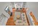 Aerial view of living room featuring wood floors, white sofas, fireplace, and chandelier at 1048 Wharf Indigo Pl, Mount Pleasant, SC 29464