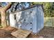 Classic white outdoor shed with double doors and a ramp, perfect for storage at 1048 Wharf Indigo Pl, Mount Pleasant, SC 29464