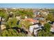 Aerial view of a neighborhood with mature trees and a view of the city skyline at 107 Bogard St, Charleston, SC 29403
