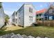 Side view of a two-story home with a small yard, fence, and patio at 107 Bogard St, Charleston, SC 29403