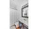 Traditional-style bathroom features a vanity with gray cabinets and a framed mirror above the sink at 107 Bogard St, Charleston, SC 29403