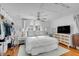 Bright bedroom features a king bed, ceiling fan, and a closet with custom built-ins for plenty of storage at 107 Bogard St, Charleston, SC 29403