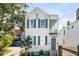 Charming two-story home with blue shutters, and a quaint second-story porch at 107 Bogard St, Charleston, SC 29403