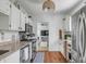 Modern kitchen with white cabinets, stainless appliances, and an open floor plan at 107 Bogard St, Charleston, SC 29403