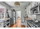 Functional kitchen with stainless steel appliances, granite countertops, and a gas range at 107 Bogard St, Charleston, SC 29403